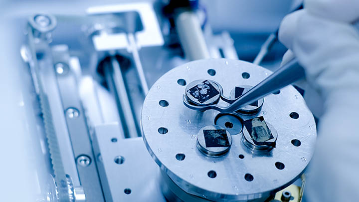 Scientist preparing nanomaterials for a Scanning Electron Microscope (SEM).