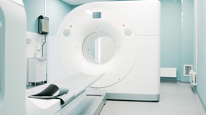 Bright room with modern MRI machine.