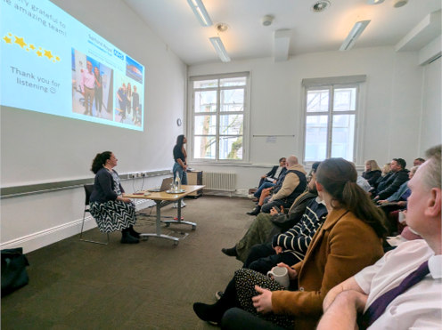 Leilah sharing her lived experience with a group of people.